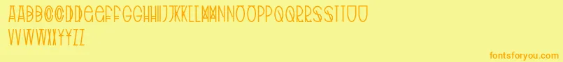 フォントTribalType – オレンジの文字が黄色の背景にあります。
