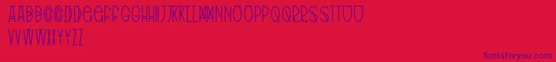 フォントTribalType – 赤い背景に紫のフォント