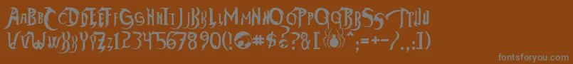 フォントThundercatsHo – 茶色の背景に灰色の文字