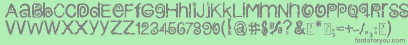 ColumbiaStroke-fontti – harmaat kirjasimet vihreällä taustalla