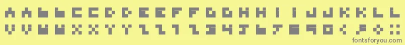BdTinyfont-fontti – harmaat kirjasimet keltaisella taustalla
