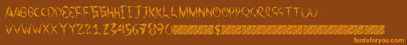 フォントAutumntwo – オレンジ色の文字が茶色の背景にあります。