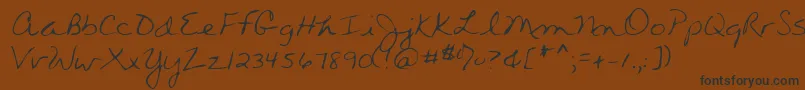 フォントWendyshand – 黒い文字が茶色の背景にあります