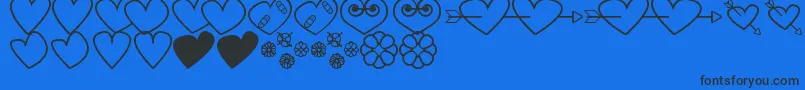 Czcionka HeartsAndFlowersForValentines – czarne czcionki na niebieskim tle