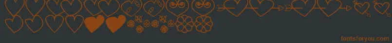 HeartsAndFlowersForValentines Font – Brown Fonts on Black Background
