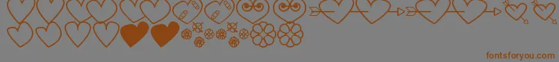 HeartsAndFlowersForValentines Font – Brown Fonts on Gray Background