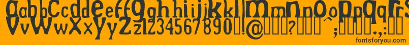 DrekNormal-fontti – mustat fontit oranssilla taustalla