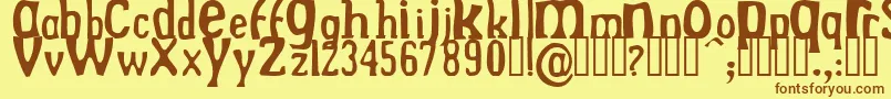 Fonte DrekNormal – fontes marrons em um fundo amarelo