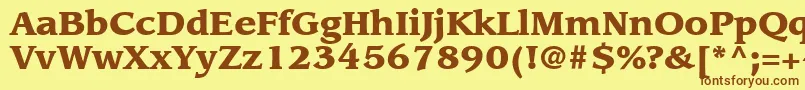 フォントItcLeawoodLtBlack – 茶色の文字が黄色の背景にあります。