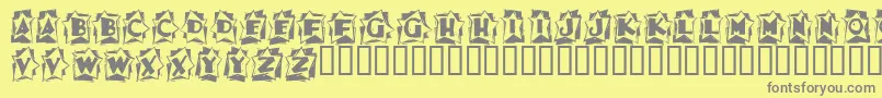 フォントAstab – 黄色の背景に灰色の文字