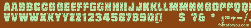 フォントLinotypetruckz – 緑色の文字が茶色の背景にあります。