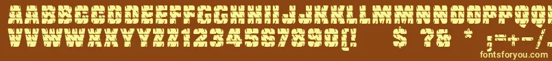 Linotypetruckz-fontti – keltaiset fontit ruskealla taustalla