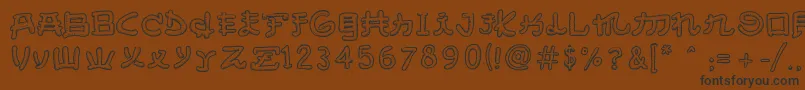 AlmostJapaneseSmooth-Schriftart – Schwarze Schriften auf braunem Hintergrund
