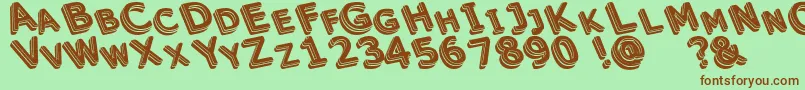 Unek Font – Brown Fonts on Green Background