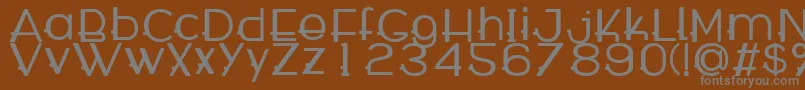 WabecoBold-fontti – harmaat kirjasimet ruskealla taustalla