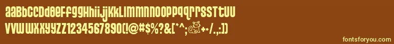 PussycatSnickers-fontti – keltaiset fontit ruskealla taustalla