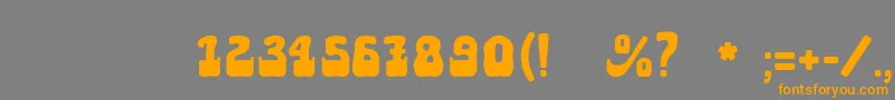 フォントAktau – オレンジの文字は灰色の背景にあります。