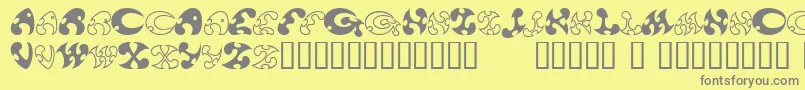 13DokusanNormal-fontti – harmaat kirjasimet keltaisella taustalla