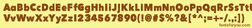 フォントHereJustNowOut – 茶色の文字が黄色の背景にあります。