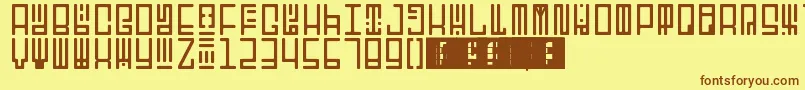 フォントTotemRegular – 茶色の文字が黄色の背景にあります。