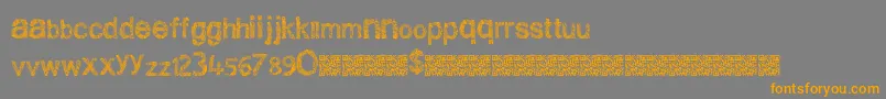 フォントCleanscratch – オレンジの文字は灰色の背景にあります。