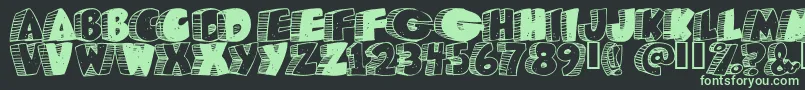 Caveman Font – Green Fonts on Black Background