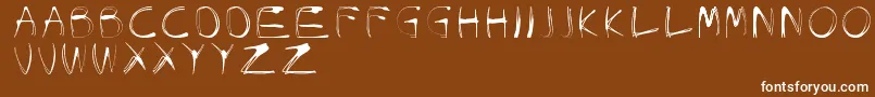 GlowCarroDanishSpiik-Schriftart – Weiße Schriften auf braunem Hintergrund