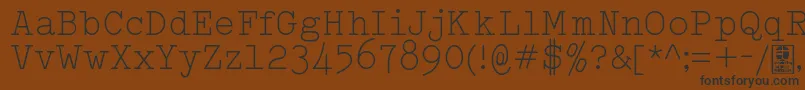Czcionka TypowriterLightDemo – czarne czcionki na brązowym tle