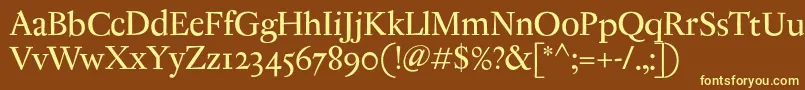 AntiqueRegent-fontti – keltaiset fontit ruskealla taustalla