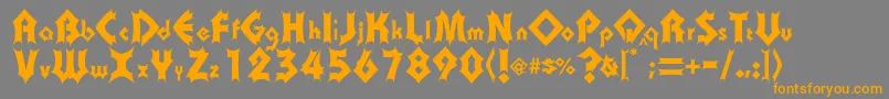 フォントTransylv – オレンジの文字は灰色の背景にあります。