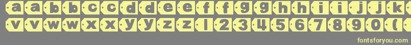 DjbTaggedAgain2 Font – Yellow Fonts on Gray Background