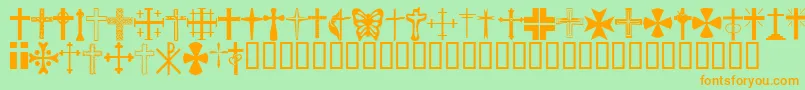 フォントChristianCrosses – オレンジの文字が緑の背景にあります。