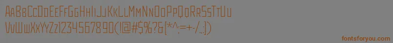 フォントRodchenkocondlightc – 茶色の文字が灰色の背景にあります。