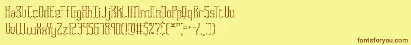 フォントFasciisc – 茶色の文字が黄色の背景にあります。