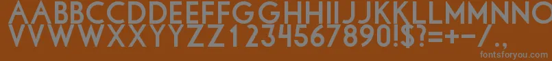 Libbybold-fontti – harmaat kirjasimet ruskealla taustalla