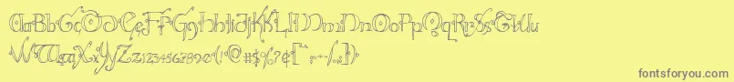 フォントHollyjinglecond – 黄色の背景に灰色の文字