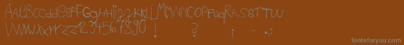 Ackipreschool Font – Gray Fonts on Brown Background