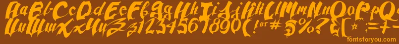 Czcionka AnpadScript – pomarańczowe czcionki na brązowym tle