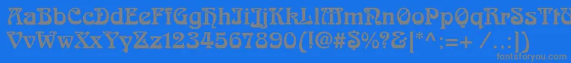 フォントSkazkac – 青い背景に灰色の文字