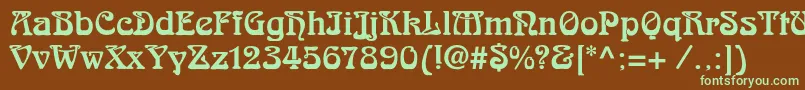 フォントSkazkac – 緑色の文字が茶色の背景にあります。