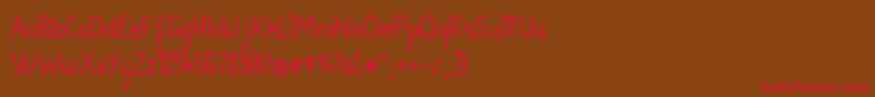 フォントAndiRegular – 赤い文字が茶色の背景にあります。