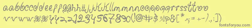 フォントSharkattack – 黄色の背景に灰色の文字
