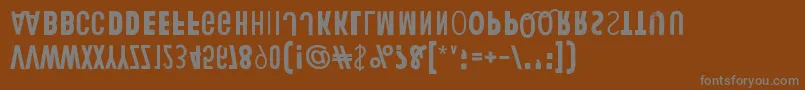 HumanErrorUpsideDown-fontti – harmaat kirjasimet ruskealla taustalla
