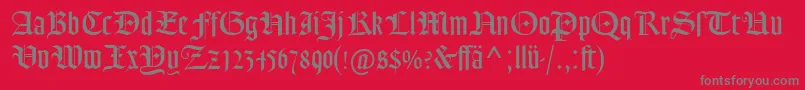 GoudyTextMtDfr-Schriftart – Graue Schriften auf rotem Hintergrund