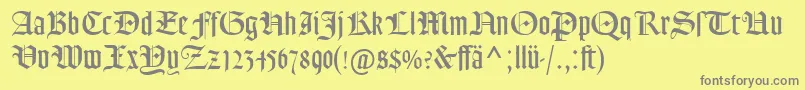 GoudyTextMtDfr-fontti – harmaat kirjasimet keltaisella taustalla