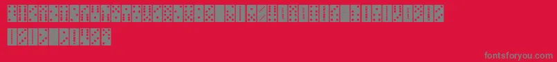 FeDominoes-fontti – harmaat kirjasimet punaisella taustalla