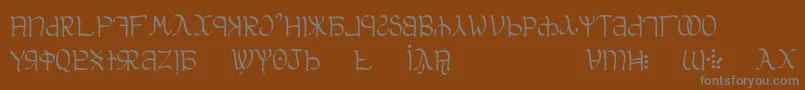 Aglab-fontti – harmaat kirjasimet ruskealla taustalla