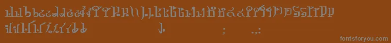 フォントTphylianGcnbold – 茶色の背景に灰色の文字