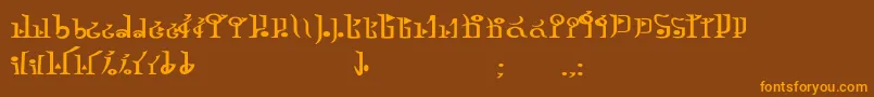 フォントTphylianGcnbold – オレンジ色の文字が茶色の背景にあります。