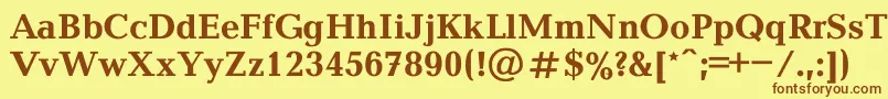 フォントBalticaBold – 茶色の文字が黄色の背景にあります。